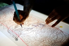 Horitamotsu drawing a dragon stencil